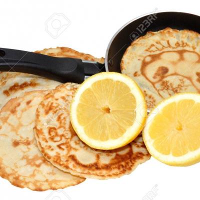 26571941-freshly-made-pancakes-with-lemon-and-frying-pan-traditionally-eaten-in-england-on-shrove-tuesday-als